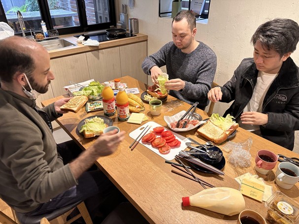 A group of men eating at a table